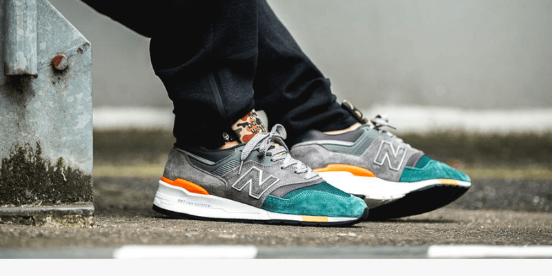 New Balance 997 grey, orange and green on men's feet